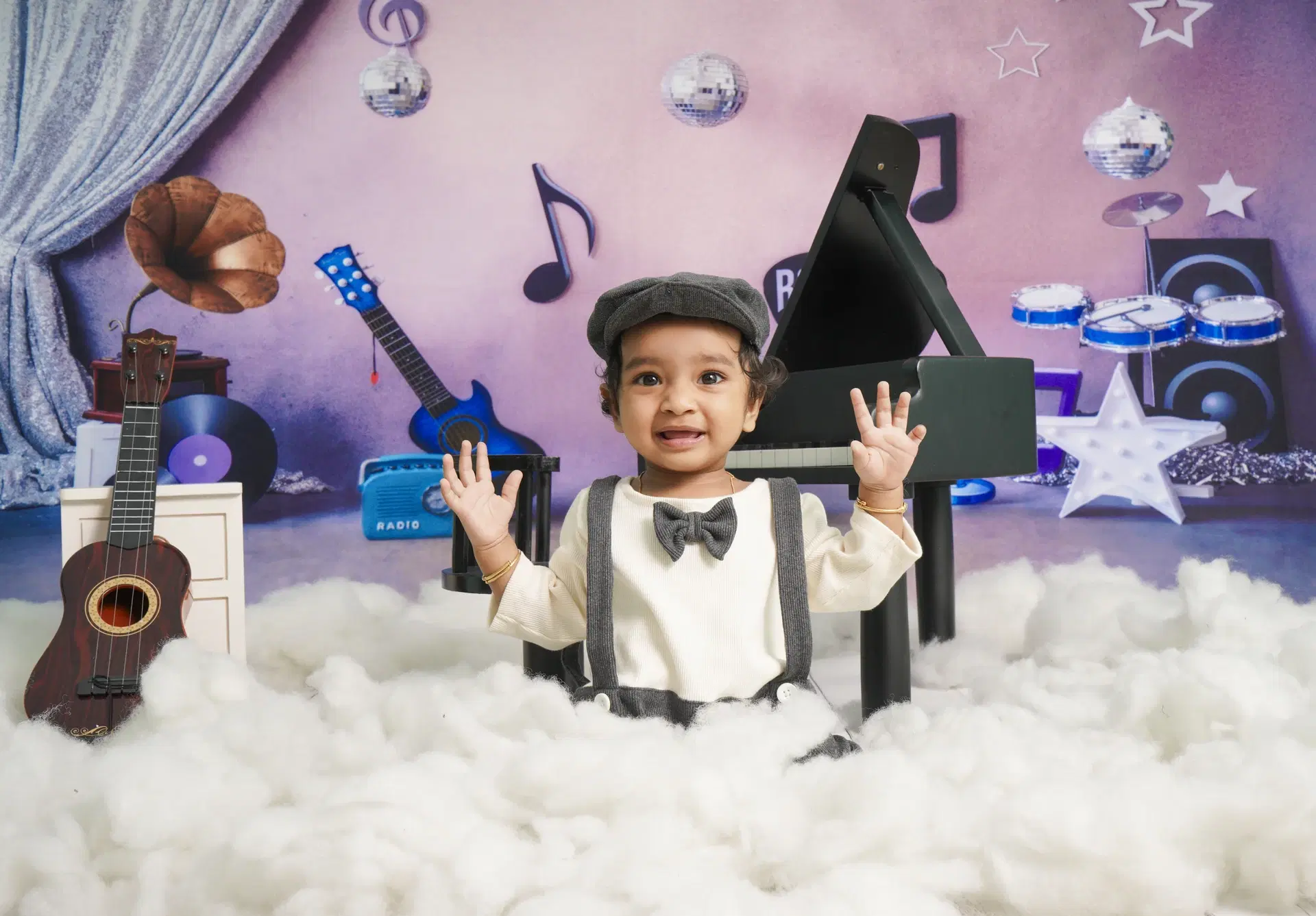 Toddler in music rockstar themed studio set